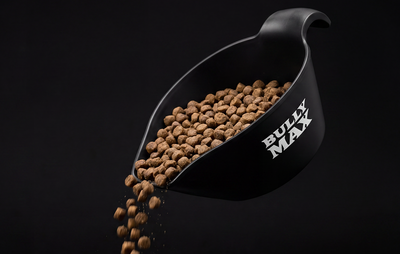 Bully Max scoop pouring dry dog food